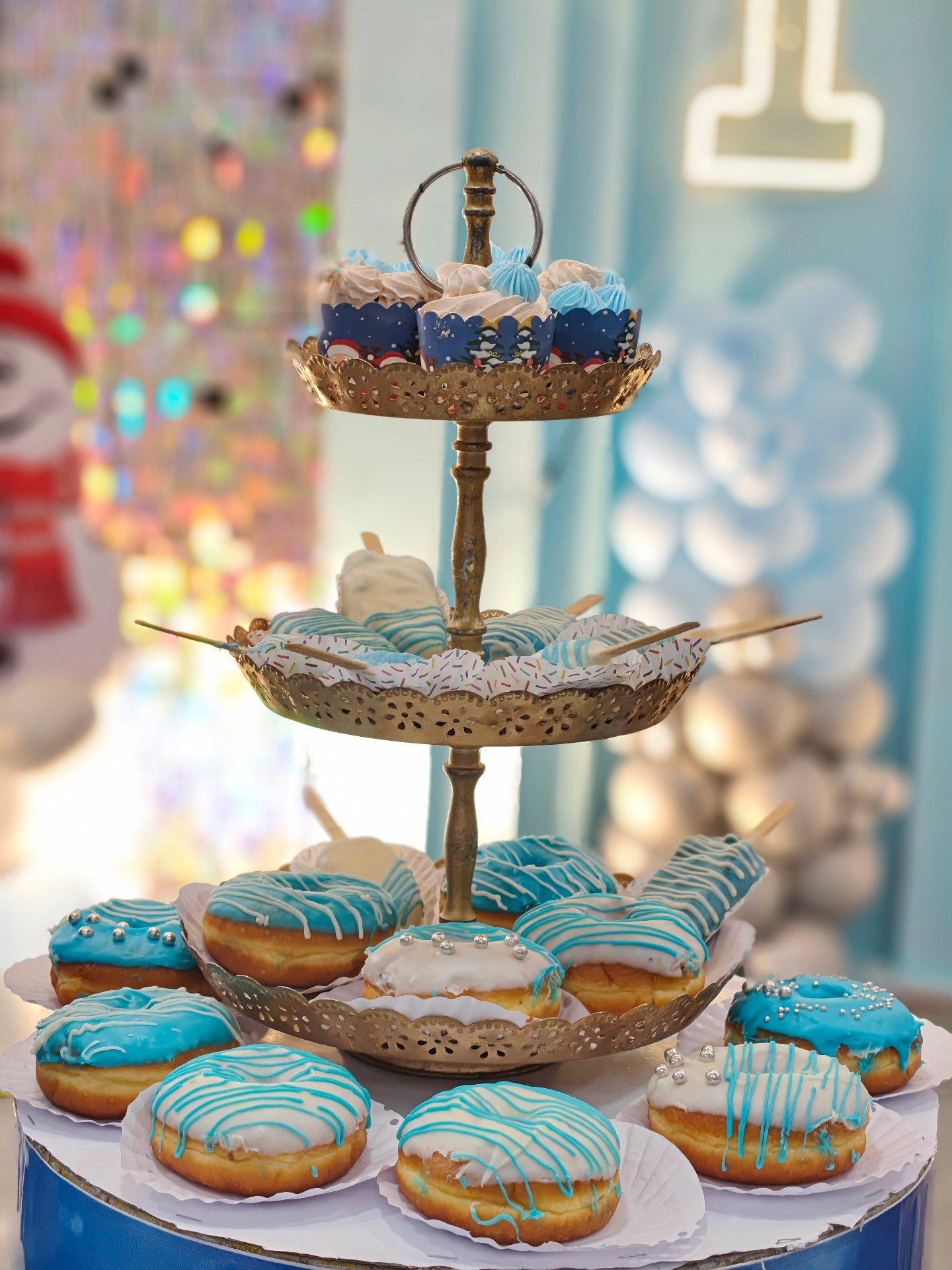 Blue-themed donut and cupcake tower